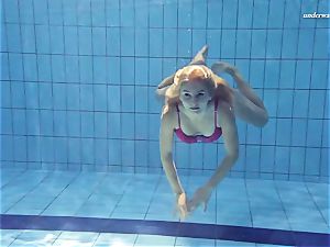 red-hot Elena showcases what she can do under water